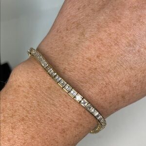 Elegant Gold Tone Stamped PAJ Princess Cut Tennis Bracelet.